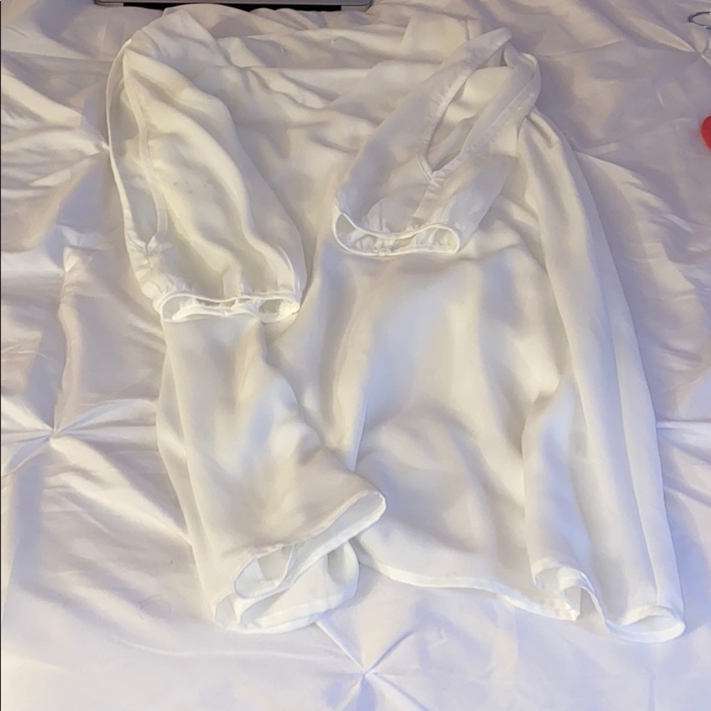 White dress with slits on sleeves